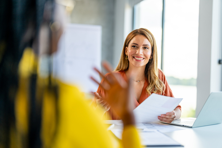 female executive coaches a student